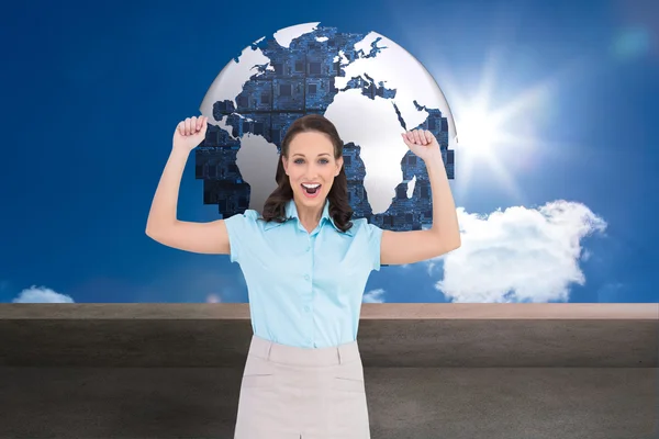 Composite image of victorious stylish businesswoman posing — Stock Photo, Image