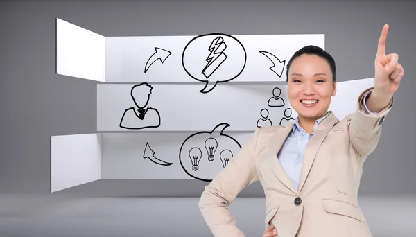 Compuesto imagen de sonriente asiática mujer de negocios señalando — Foto de Stock