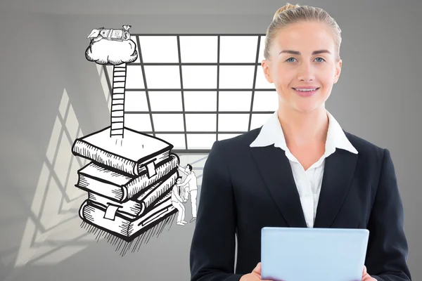 Blonde businesswoman holding tablet — Stock Photo, Image