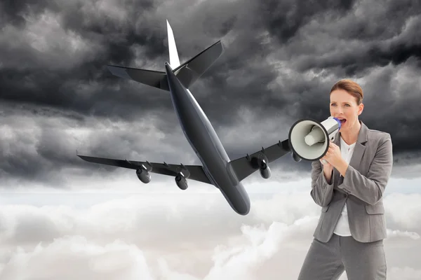 Businesswoman talking on a megaphone — Stock Photo, Image