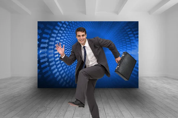 Imagen compuesta de hombre de negocios feliz en una furia —  Fotos de Stock