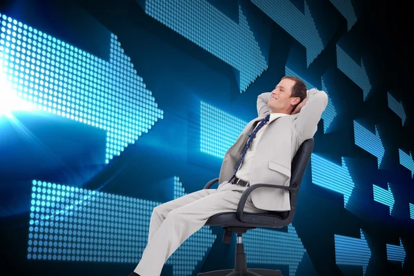 Businessman leaning back in his chair — Stock Photo, Image