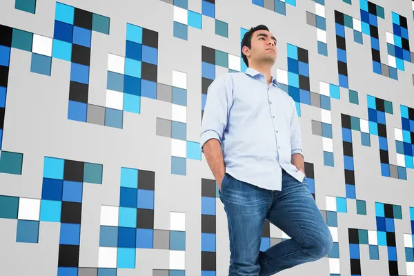 Imagen compuesta de un hombre casual no sonriente de pie —  Fotos de Stock