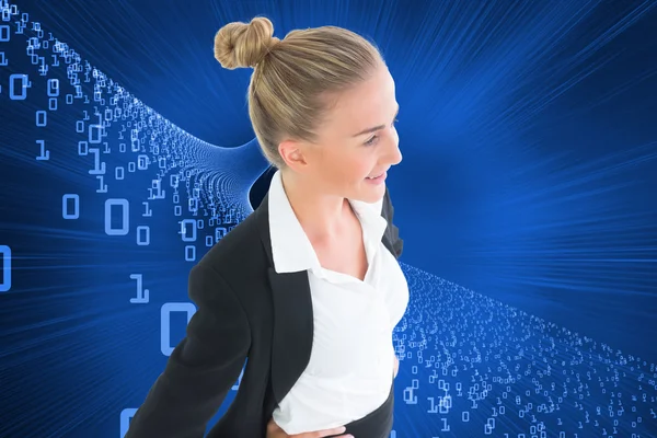 Composite image of businesswoman standing with hands on hips — Stock Photo, Image