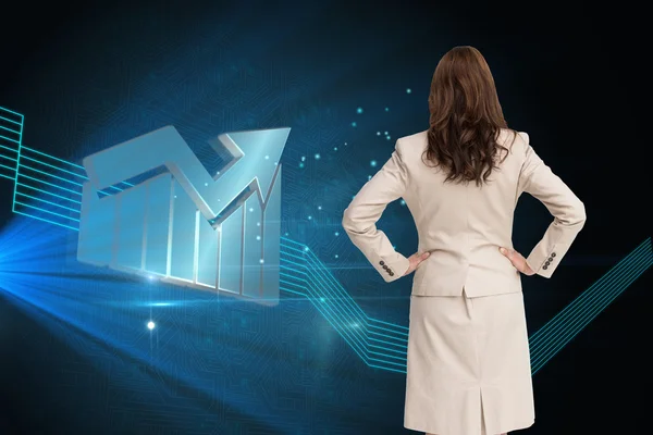 Businesswoman standing back to camera with hands on hips — Stock Photo, Image