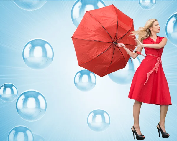 Elegant blonde holding umbrella — Stock Photo, Image