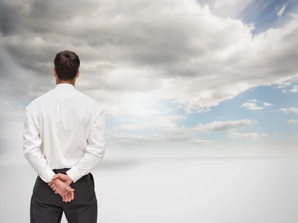 Composite image of businessman turning his back to camera — Stock Photo, Image