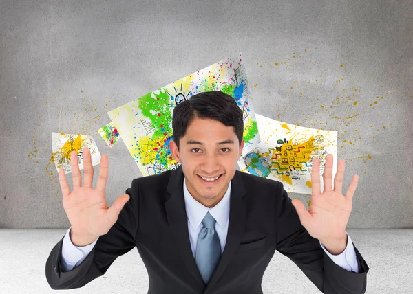 Samengestelde afbeelding van lachende Aziatische zakenman bedrijf in handen — Stockfoto