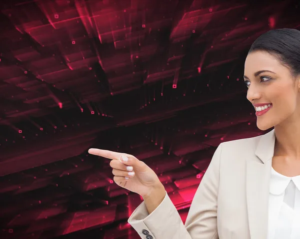 Smiling businesswoman pointing — Stock Photo, Image