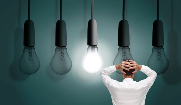 Composite image of businessman standing back to camera hands — Stock Photo, Image