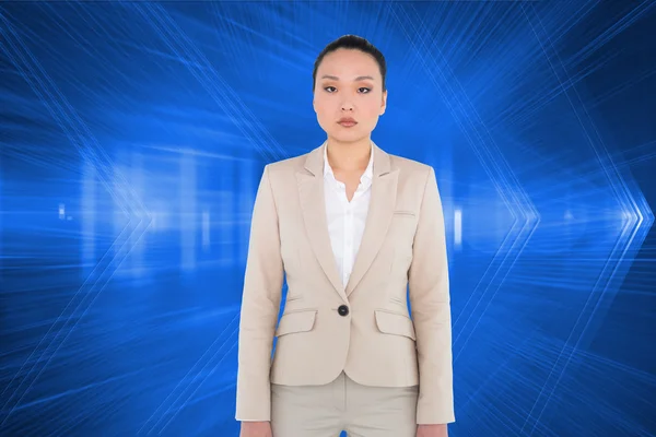 Composite image of unsmiling asian businesswoman — Stock Photo, Image