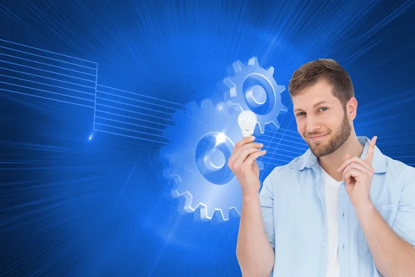 Model holding a bulb in right hand — Stock Photo, Image