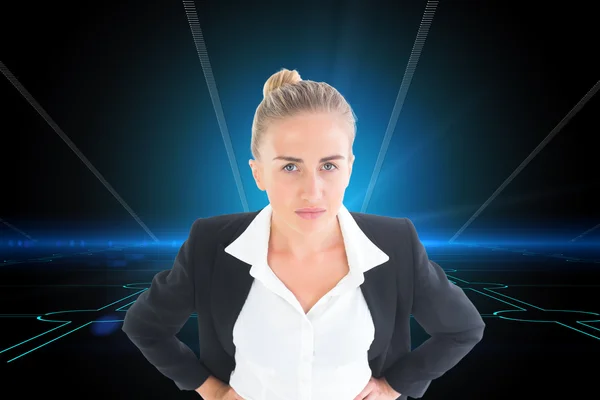 Businesswoman standing with hands on hips — Stock Photo, Image