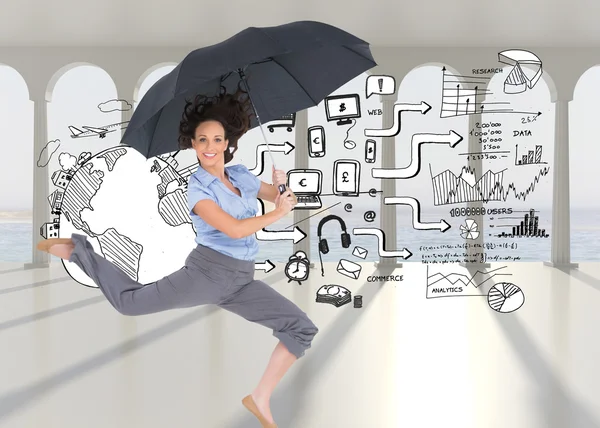 Businesswoman jumping while holding umbrella — Stock Photo, Image