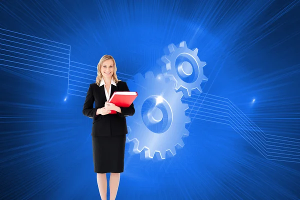 Businesswoman smiling and holding folders — Stock Photo, Image