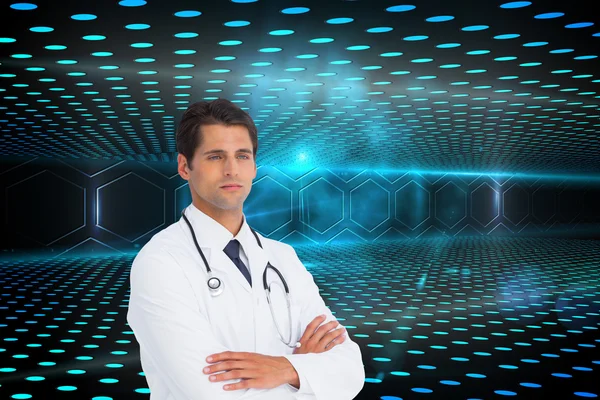 Composite image of serious doctor with arms crossed — Stock Photo, Image