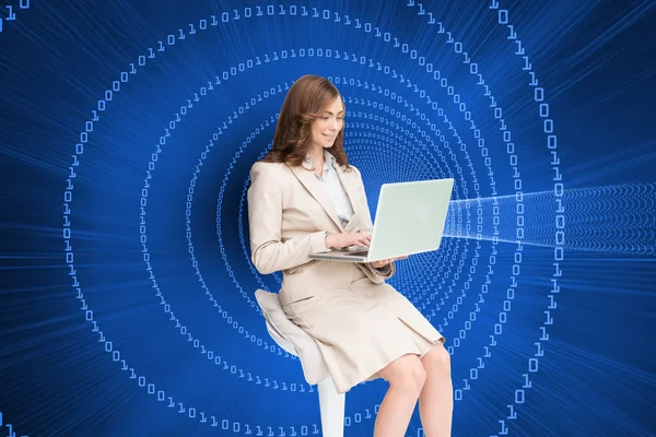 Businesswoman sitting and using laptop — Stock Photo, Image