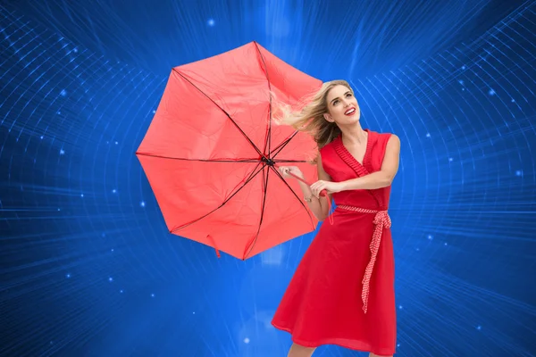 Sammansatt bild av eleganta blond anläggning paraply — Stockfoto