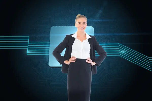 Composite image of businesswoman standing with hands on hips — Stock Photo, Image