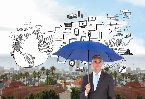 Composite image of businessman smiling at camera and holding blue umbrella — Stock Photo, Image
