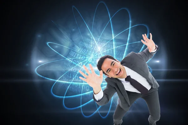 Composite image of excited businessman with arms raised — Stock Photo, Image