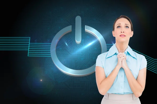 Composite image of troubled young businesswoman praying — Stock Photo, Image