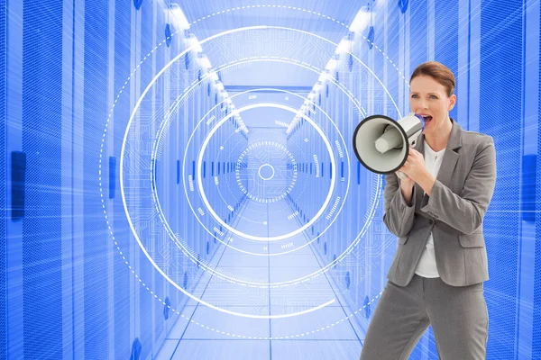 Businesswoman talking on a megaphone — Stock Photo, Image