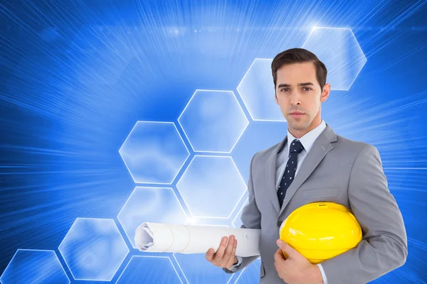 Architect holding plans and hard hat — Stock Photo, Image