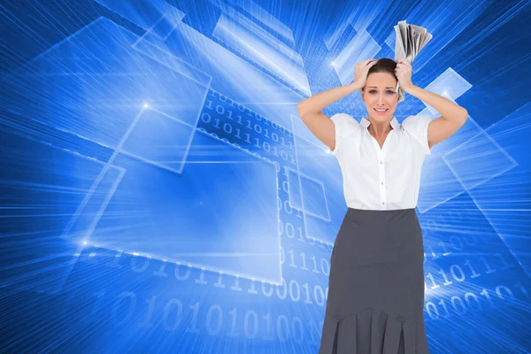 Worried stylish businesswoman holding newspaper — Stock Photo, Image