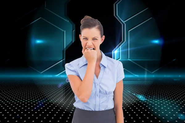 Composite image of furious businesswoman looking at the camera — Stock Photo, Image