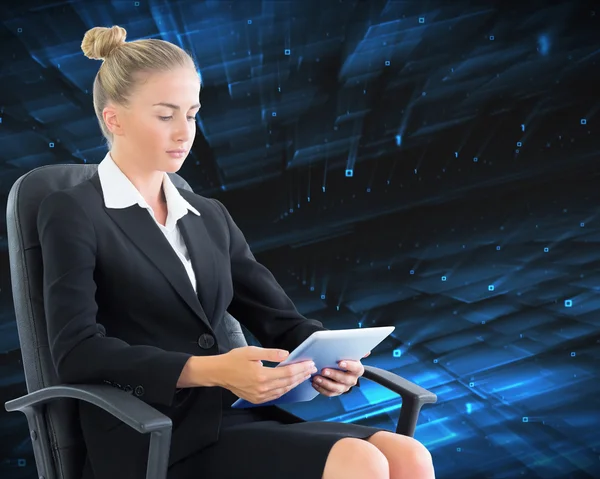 Composite image of businesswoman sitting on swivel chair with tablet — Stock Photo, Image