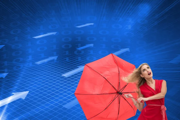 Composite image of elegant blonde holding umbrella — Stock Photo, Image