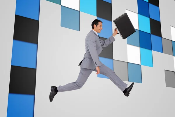 Empresário correndo com uma mala — Fotografia de Stock
