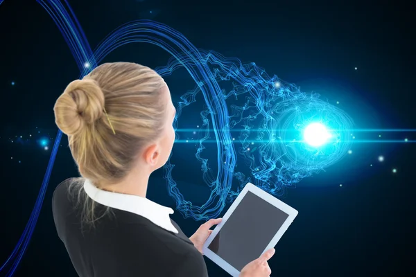 Composite image of businesswoman holding tablet — Stock Photo, Image