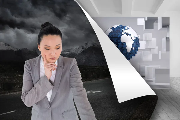 Composite image of unsmiling asian businesswoman pointing — Stock Photo, Image