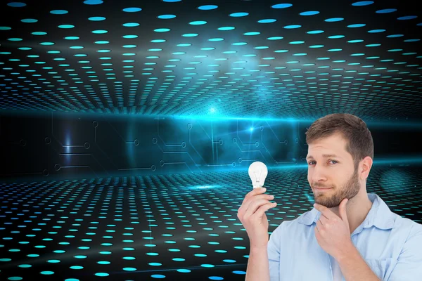 Handsome model holding a bulb — Stock Photo, Image