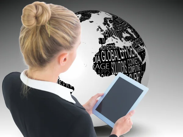 Composite image of businesswoman holding tablet — Stock Photo, Image