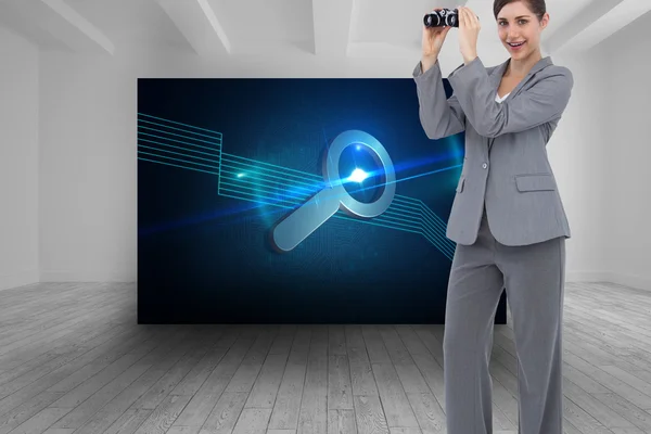 Composite image of businesswoman posing with binoculars — Stock Photo, Image