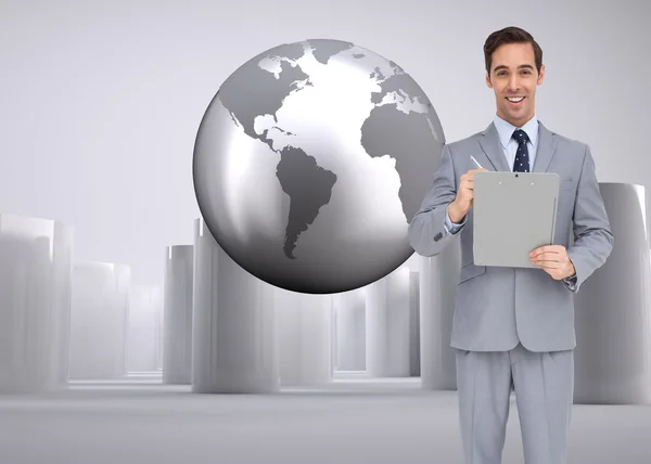 Happy businessman holding a clipboard — Stock Photo, Image