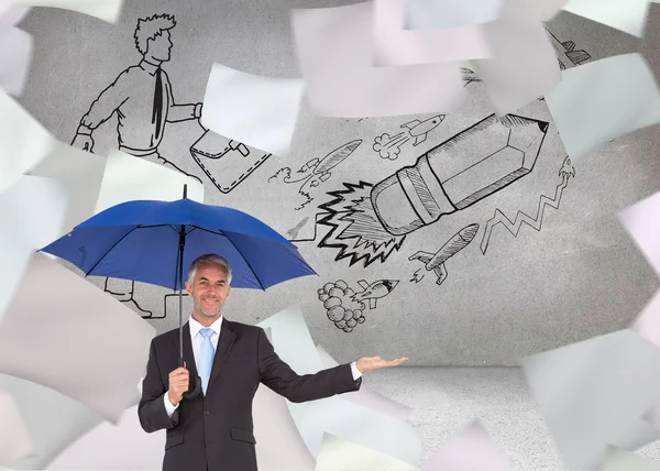 Composite image of peaceful businessman holding blue umbrella — Stock Photo, Image