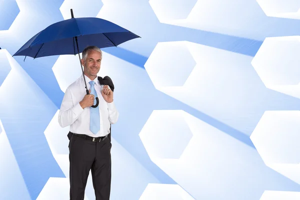 Empresário segurando guarda-chuva — Fotografia de Stock