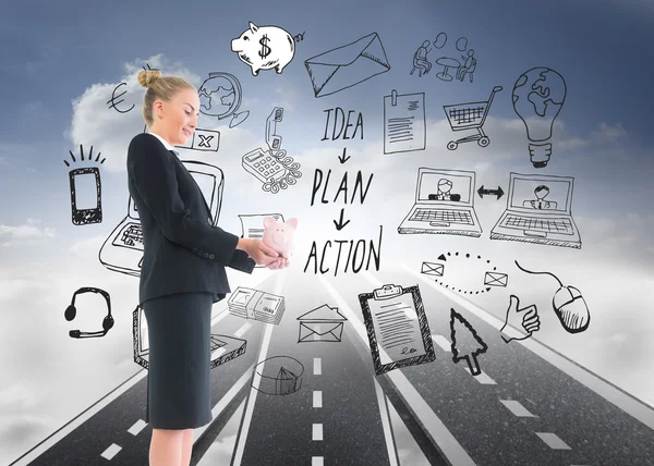 Composite image of businesswoman holding pink piggy bank — Stock Photo, Image