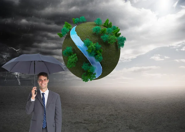 Imagem composta de homem de negócios feliz segurando guarda-chuva cinza — Fotografia de Stock