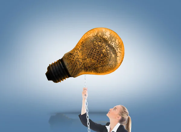 Composite image of businesswoman pulling a chain — Stock Photo, Image