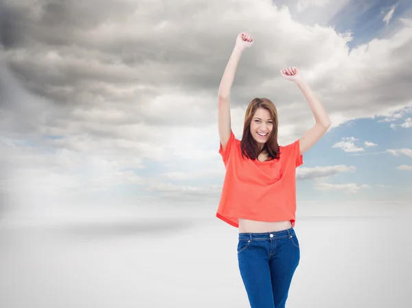 Teenage wearing casual clothes while raising her arms — Stock Photo, Image