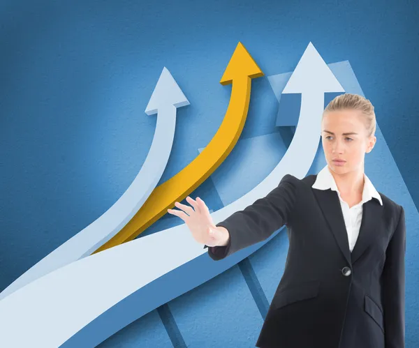 Composite image of businesswoman pointing somewhere — Stock Photo, Image