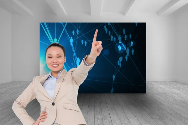 Compuesto imagen de sonriente asiática mujer de negocios señalando — Foto de Stock