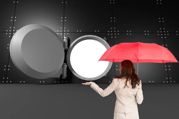Композитне зображення бізнес-леді, що тримає парасольку — стокове фото