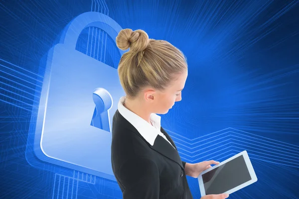 Composite image of businesswoman holding tablet — Stock Photo, Image