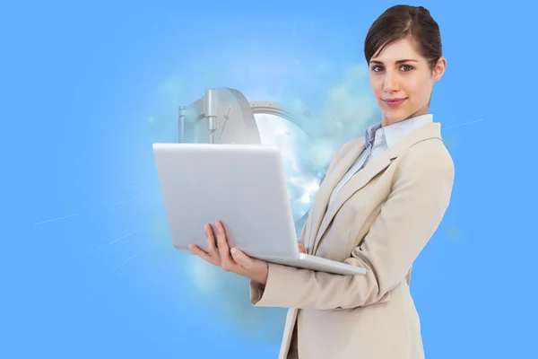 Confident young businesswoman with laptop — Stock Photo, Image